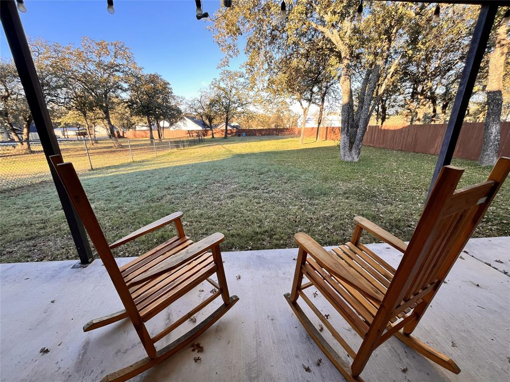 420 Sessums Road Springtown, TX 76082 - Photo 36 of 40 a view of a backyard with sitting area