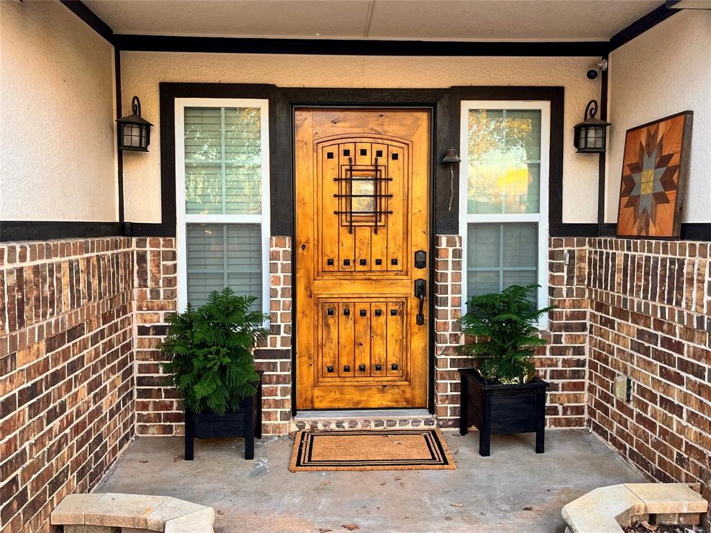 420 Sessums Road Springtown, TX 76082 - Photo 6 of 40 a view of front door with outdoor seating