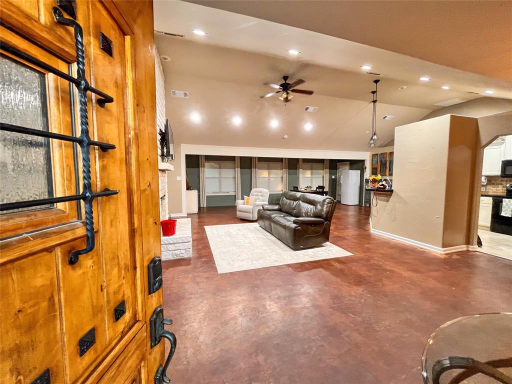420 Sessums Road Springtown, TX 76082 - Photo 7 of 40 a living room with furniture and a flat screen tv