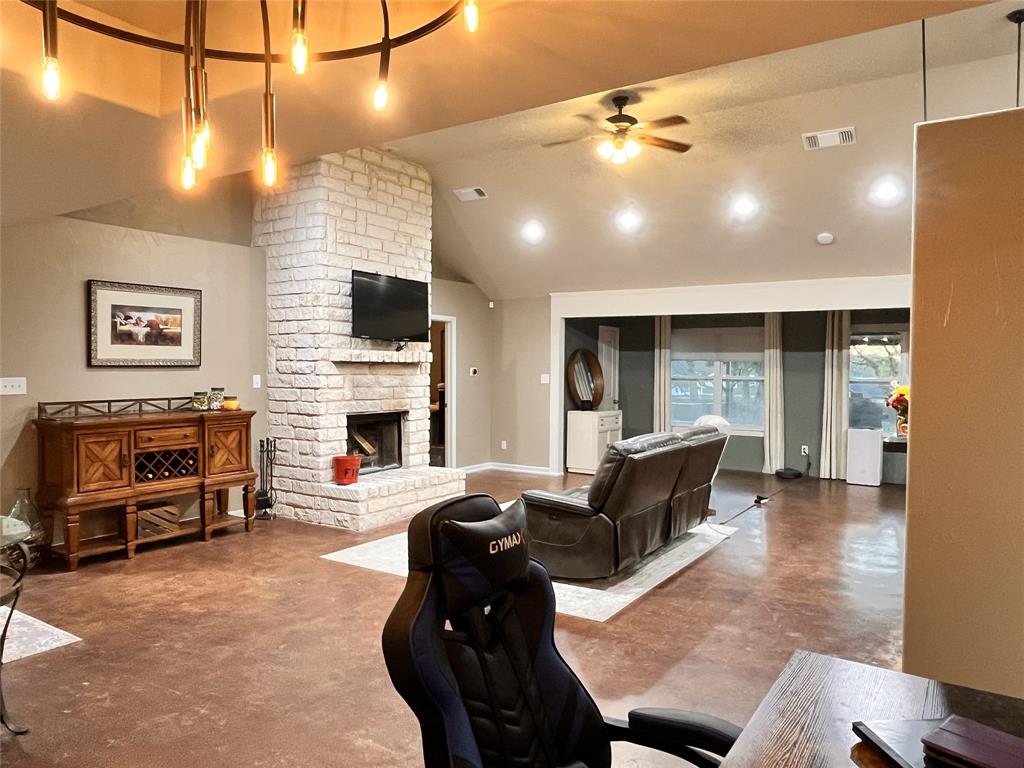420 Sessums Road Springtown, TX 76082 - Photo 10 of 40 a living room with furniture and a flat screen tv