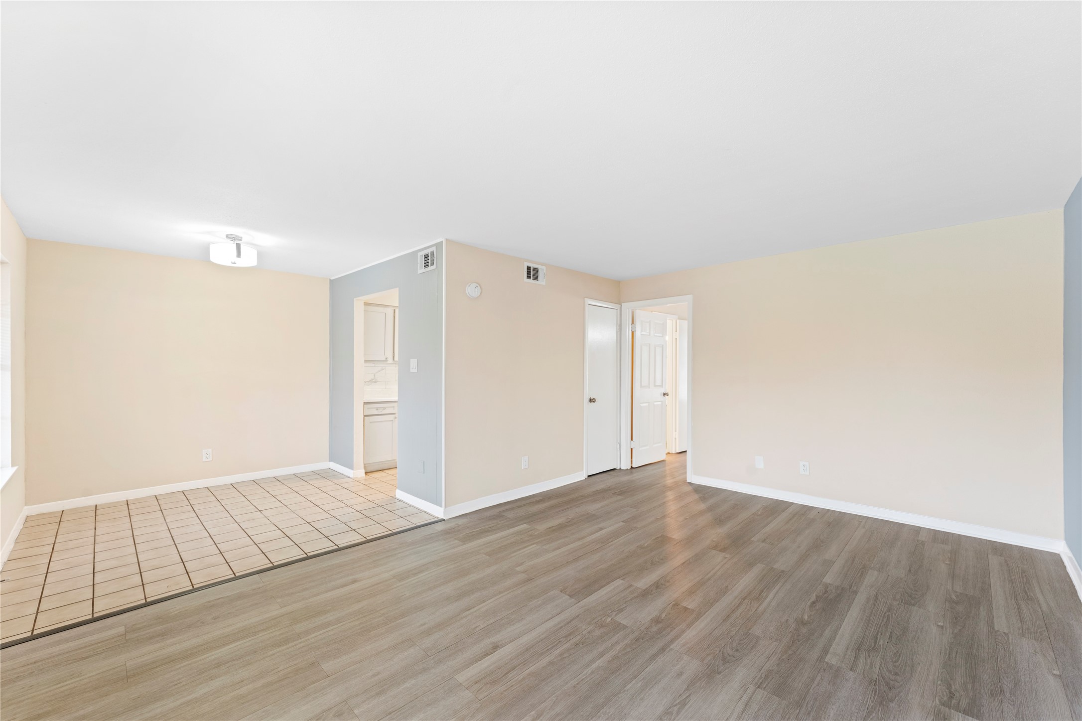 3316 Burke Road, Unit 43 Pasadena, TX 77504 - Photo 4 of 15 an empty room with wooden floor