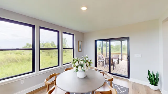 a dining room with furniture wooden floor and a potted plant
