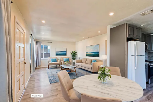 a living room with furniture and a table