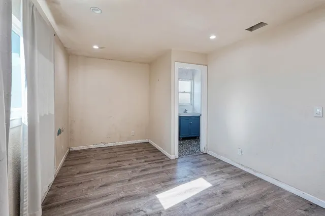 a view of hallway with wooden floor