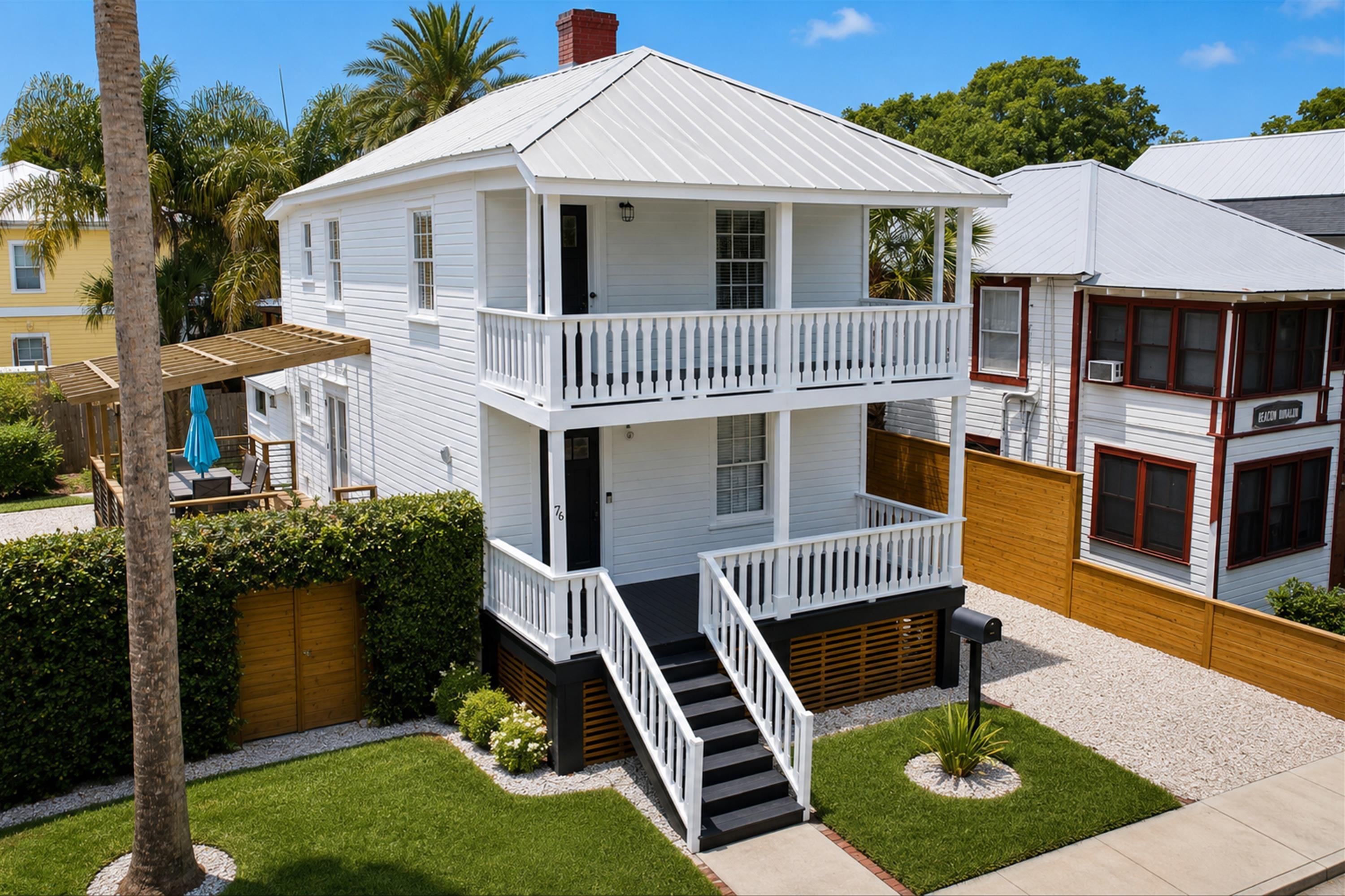 76 Oneida Street St. Augustine, FL 32084 - Photo 1 of 38 a front view of a house with garden