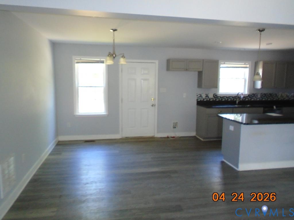 2707 Berry Road Richmond, VA 23234 - Photo 3 of 16 Open concept living area featuring wood-finish flo