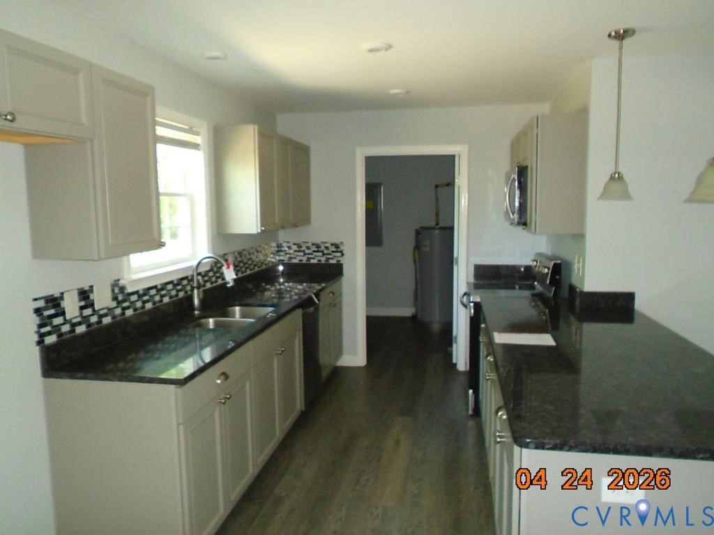 2707 Berry Road Richmond, VA 23234 - Photo 4 of 16 Galley kitchen featuring light-toned cabinetry, da