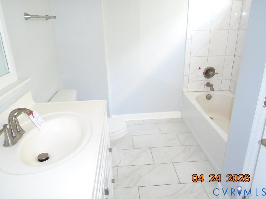 2707 Berry Road Richmond, VA 23234 - Photo 7 of 16 Bathroom featuring a built-in bathtub with subway