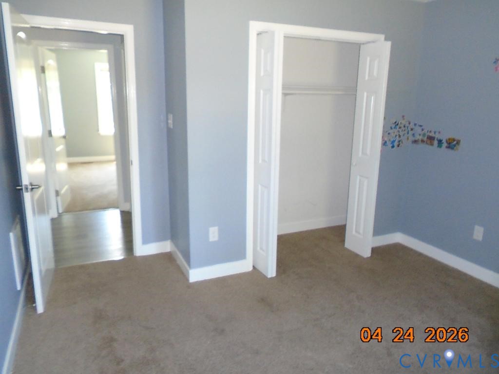 2707 Berry Road Richmond, VA 23234 - Photo 10 of 16 Bedroom featuring light blue walls, tan carpet flo