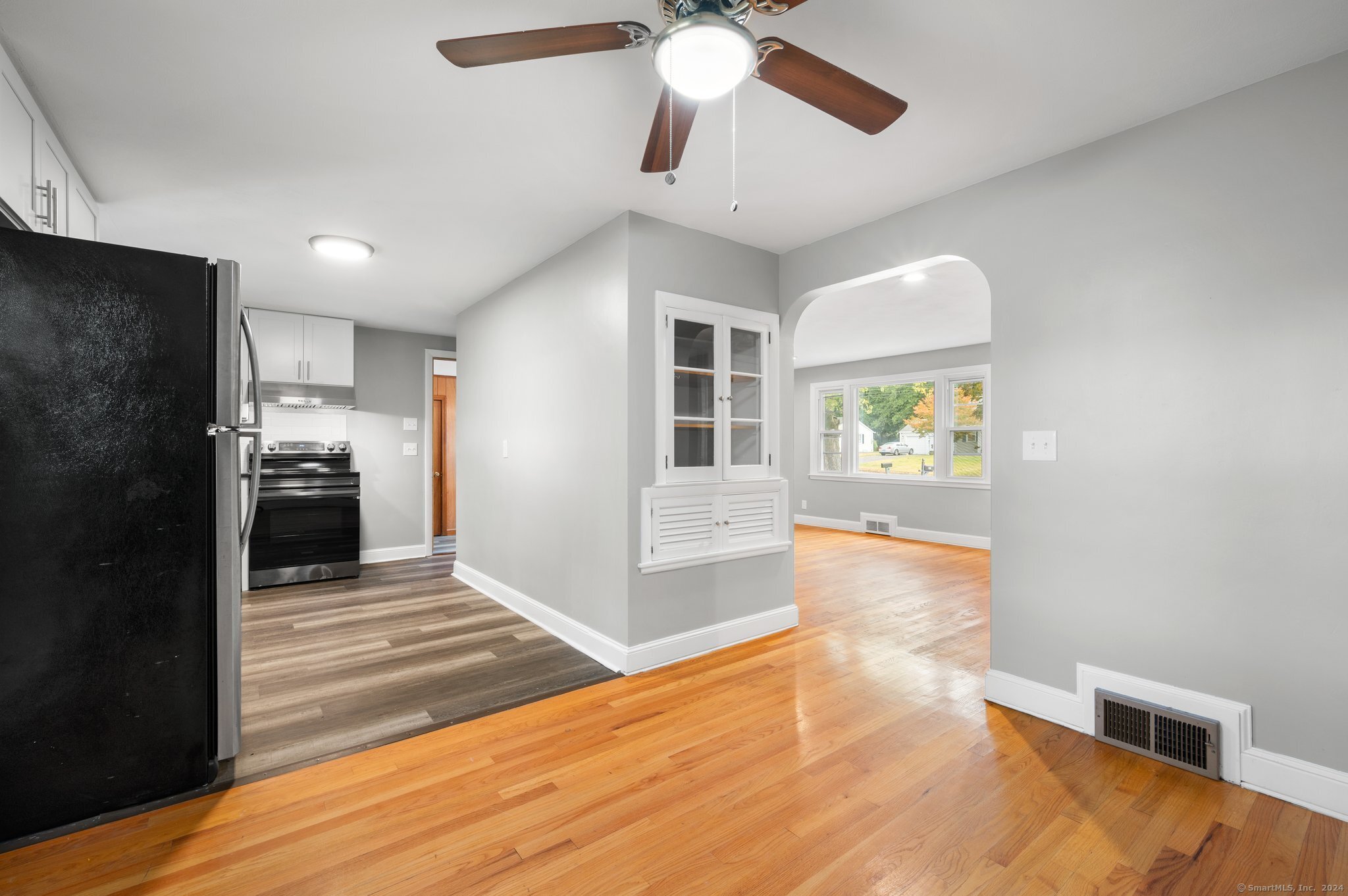 21 Davis Road East Hartford, CT 06118 - Photo 11 of 21 a view of a kitchen with furniture and a ceiling fan