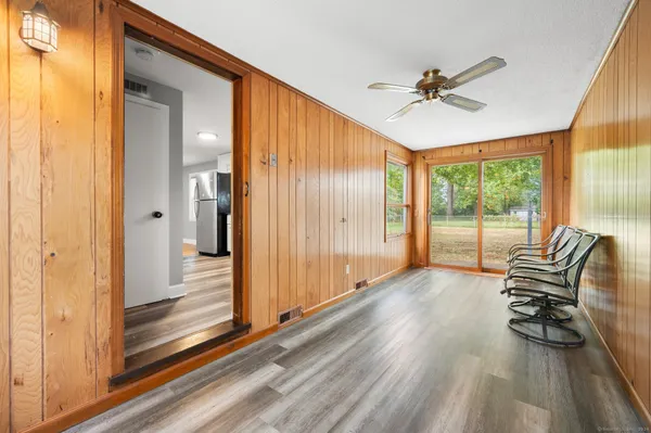 a view of outdoor space with wooden floor and windows