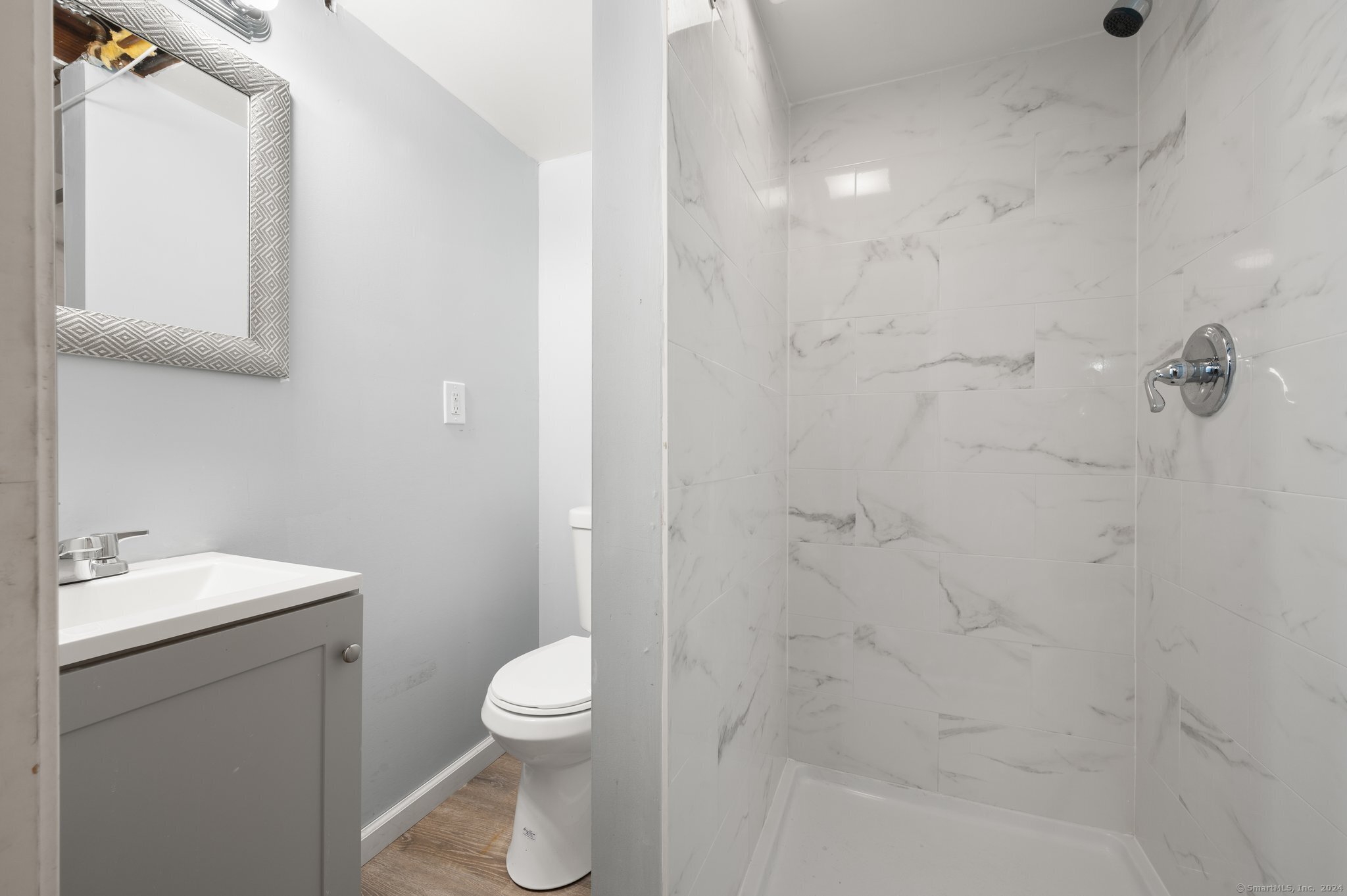 21 Davis Road East Hartford, CT 06118 - Photo 6 of 21 a bathroom with a toilet a sink and shower