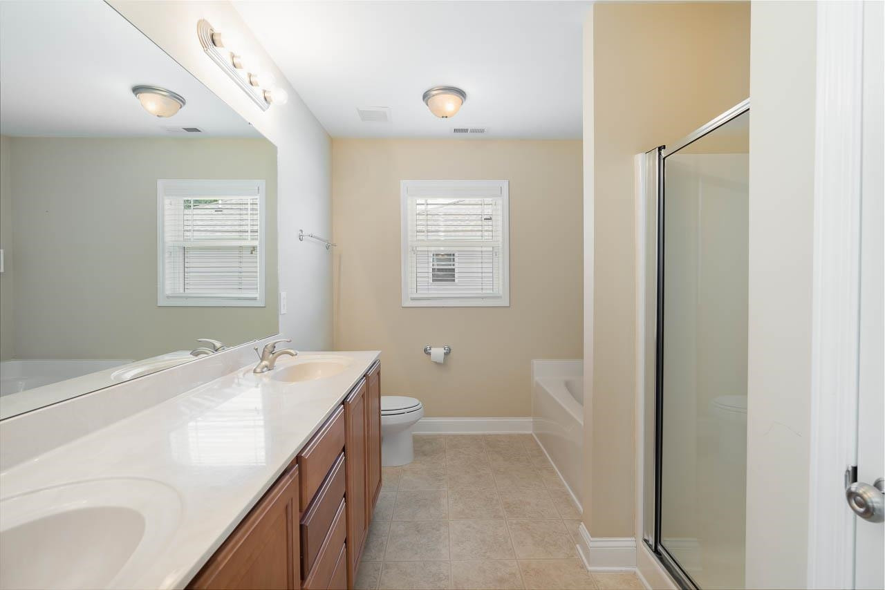 3918 Magnolia Pond Road Raleigh, NC 27610 - Photo 18 of 26 Double Vanity with garden tub and separate shower. Primary Bathroom