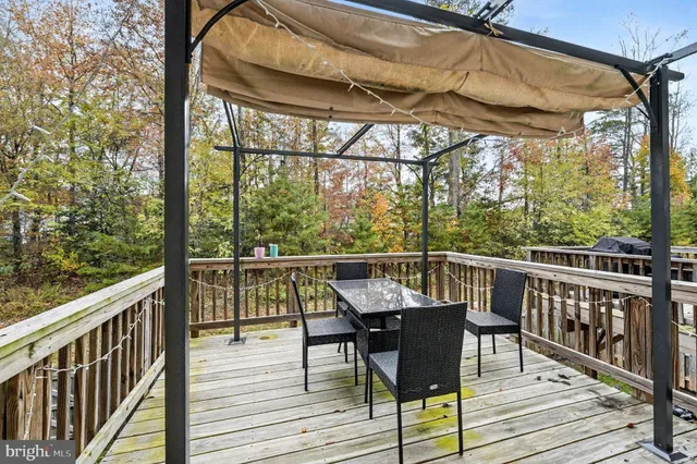 a view of a balcony with wooden floor