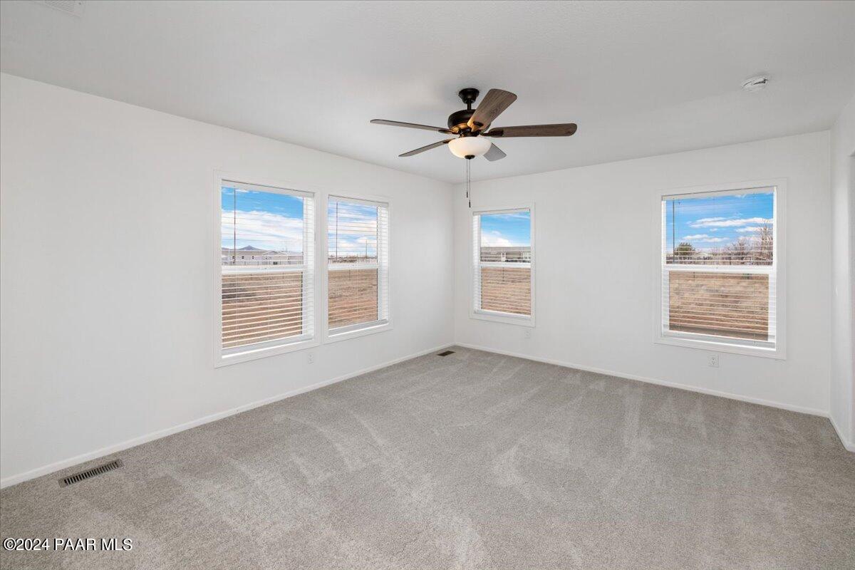 25341 North Mitchell Road Paulden, AZ 86334 - Photo 7 of 17 a view of an empty room with a window