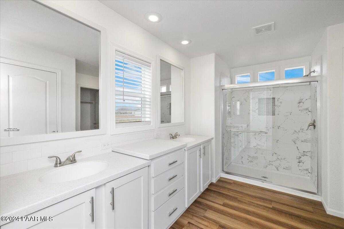 25341 North Mitchell Road Paulden, AZ 86334 - Photo 8 of 17 a bathroom with a granite countertop sink and a mirror