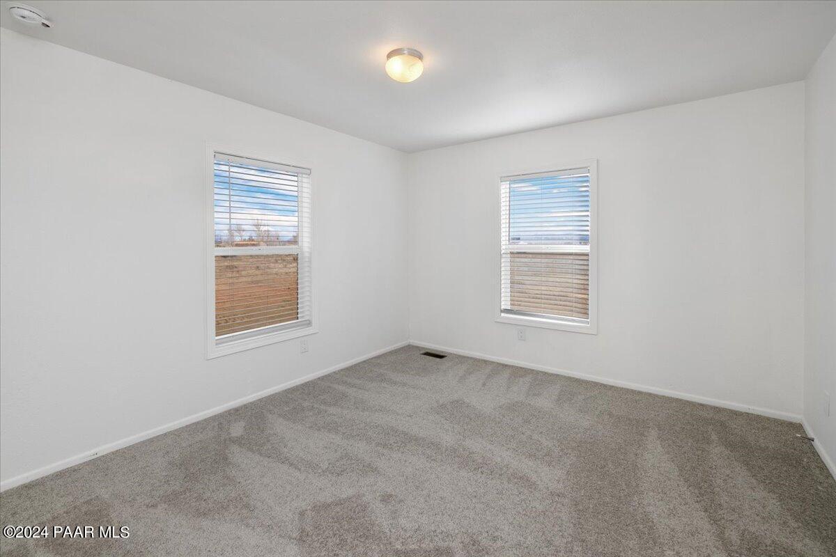25341 North Mitchell Road Paulden, AZ 86334 - Photo 9 of 17 an empty room with windows