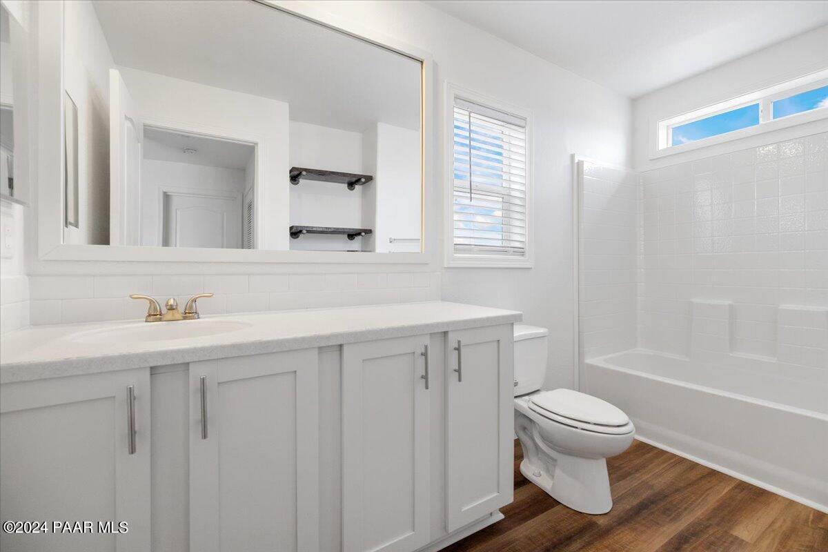 25341 North Mitchell Road Paulden, AZ 86334 - Photo 10 of 17 a bathroom with a sink toilet and shower
