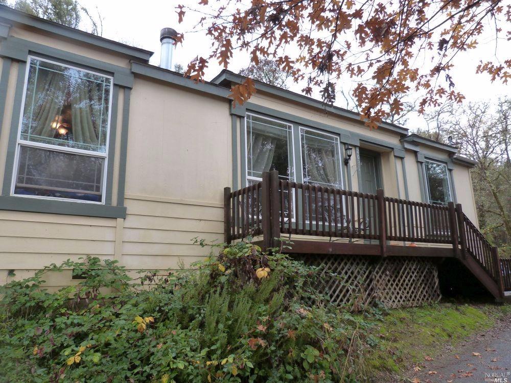 2031 Rd B Redwood Valley, CA 95470 - Photo 1 of 1 a view of a house with a small yard and wooden fence
