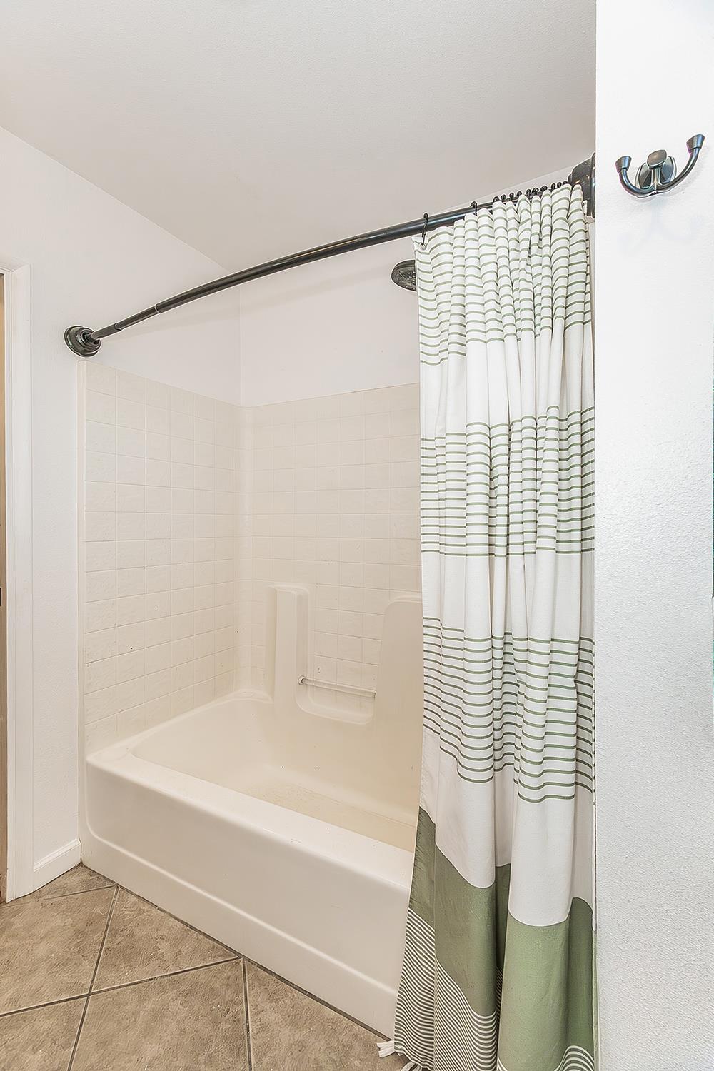 34664 Wilson Road Auberry, CA 93602 - Photo 20 of 35 a bathroom with a shower and a bathtub