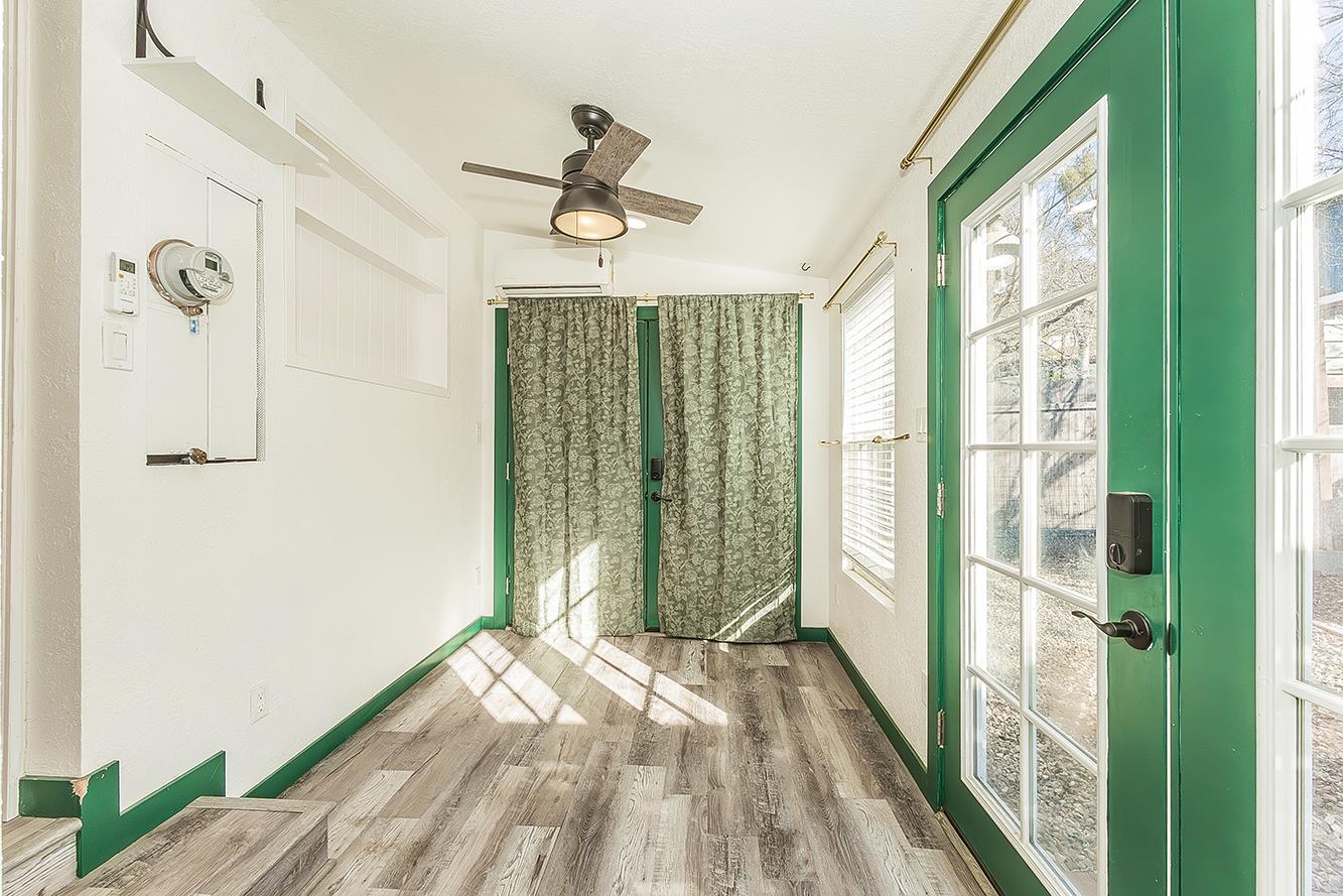 34664 Wilson Road Auberry, CA 93602 - Photo 25 of 35 a view of a hallway with wooden floor and a bathroom