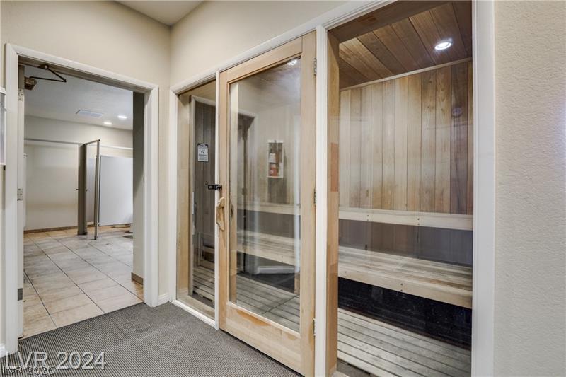 3145 East Flamingo Road, Unit 2129 Las Vegas, NV 89121 - Photo 41 of 43 Experience deep relaxation in this inviting sauna, complete with warm wood paneling and comfortable benches.