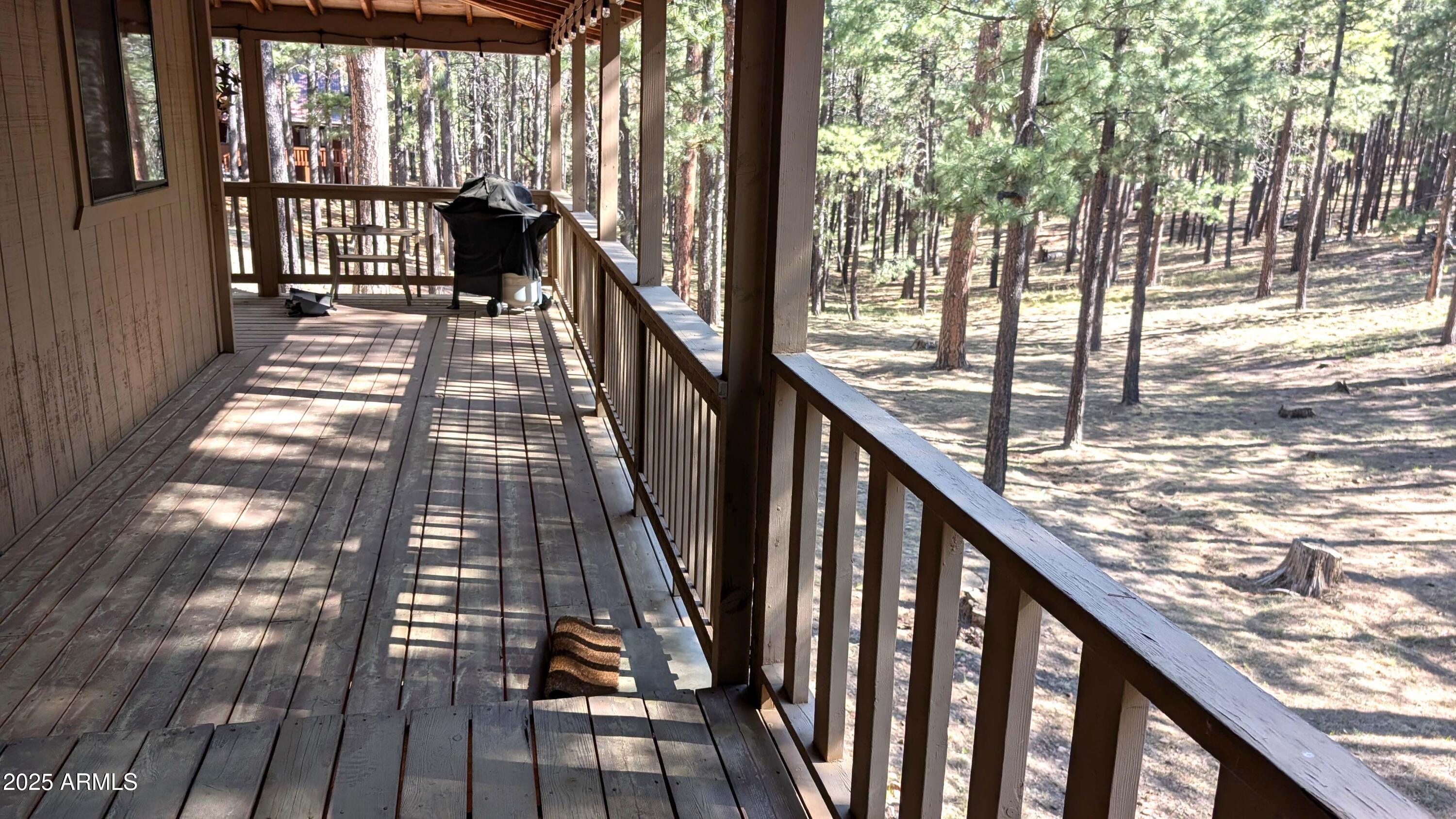 2425 Tall Trees Loop Forest Lakes, AZ 85931 - Photo 27 of 43 a view of balcony with wooden floor and fence