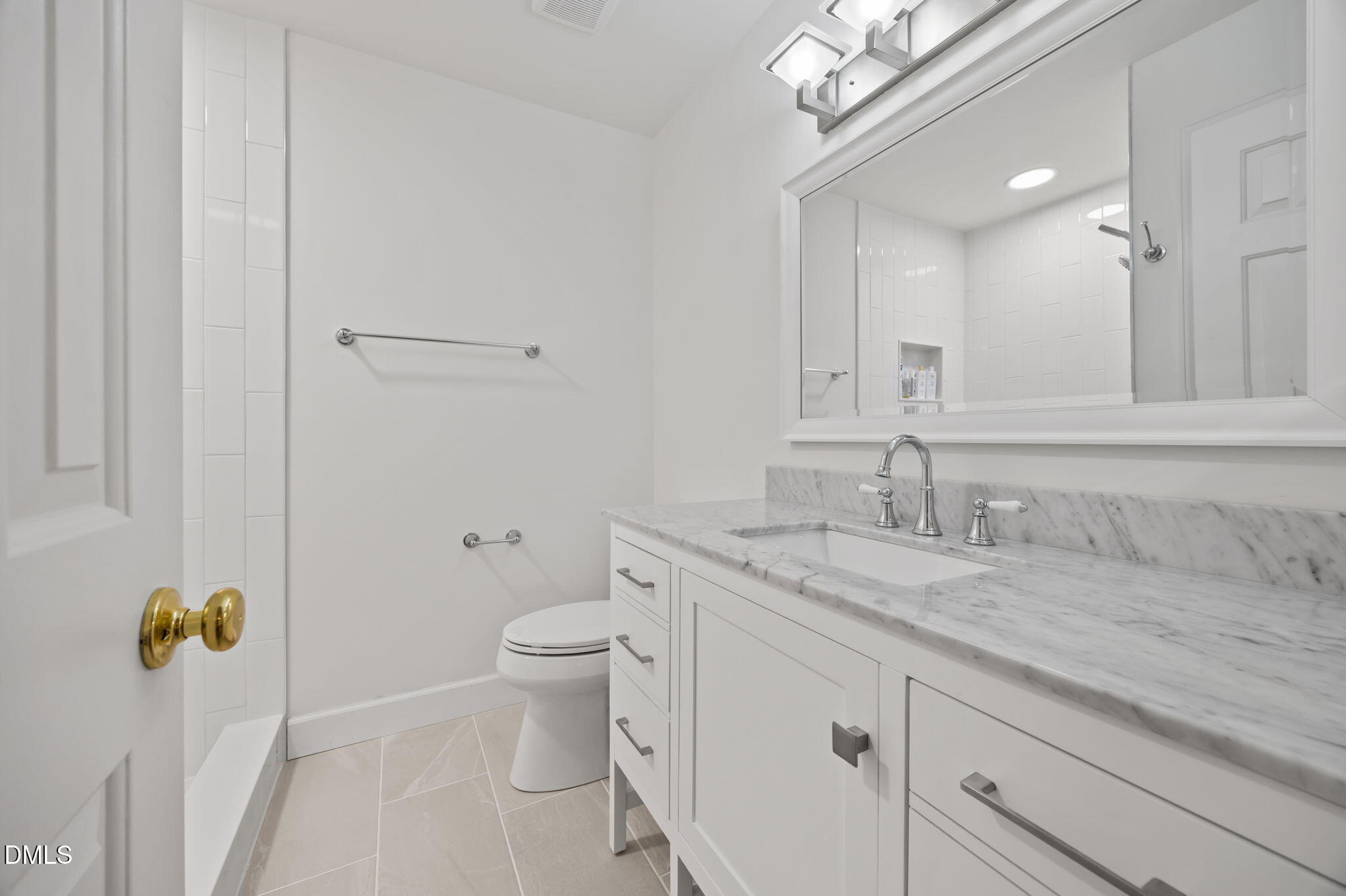 562 Weathergreen Drive Raleigh, NC 27615 - Photo 20 of 47 a bathroom with a granite countertop sink a toilet and a mirror