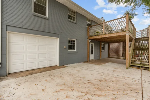 a balcony with wooden floor and fence