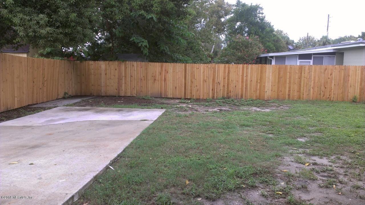 3436 Rogero Road Jacksonville, FL 32277 - Photo 4 of 6 a view of backyard with wooden fence