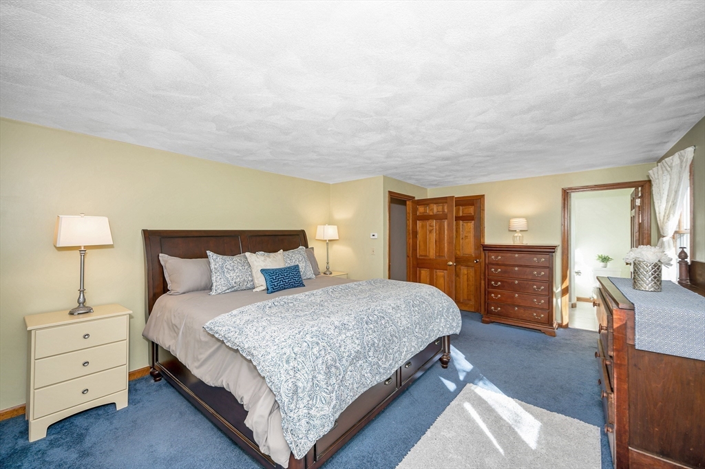 16 Haystack Road Reading, MA 01867 - Photo 16 of 42 a bedroom with a bed and furniture