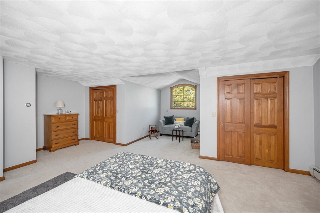 16 Haystack Road Reading, MA 01867 - Photo 21 of 42 a bedroom with furniture and a window
