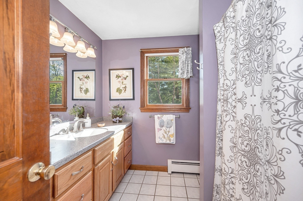 16 Haystack Road Reading, MA 01867 - Photo 24 of 42 a spacious bathroom with a sink a vanity and a mirror