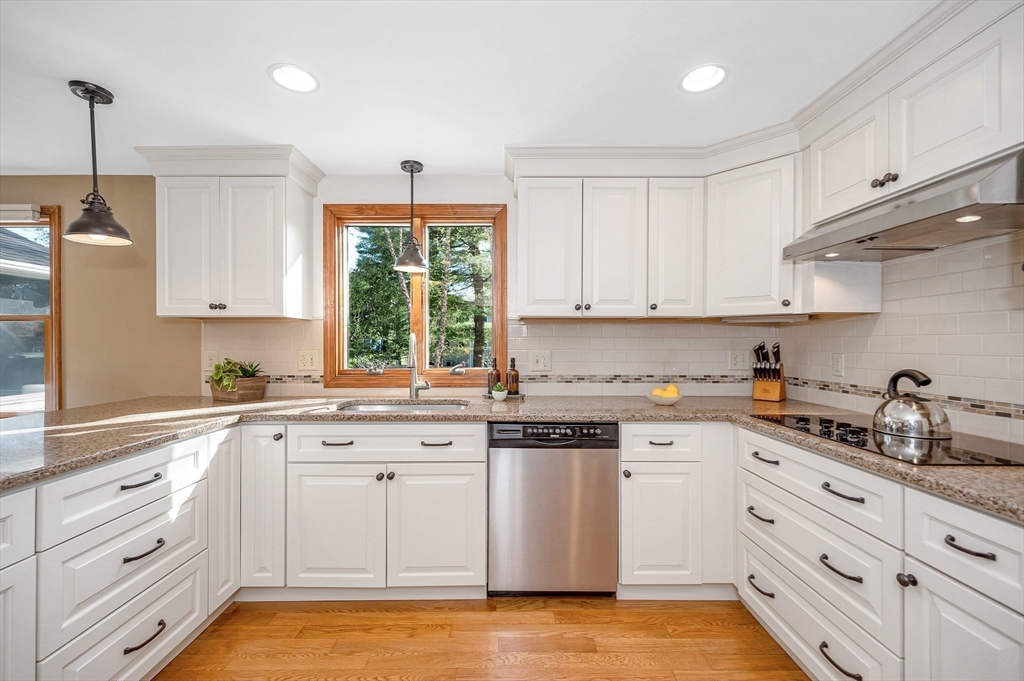 16 Haystack Road Reading, MA 01867 - Photo 8 of 42 a kitchen with cabinets appliances a sink and a window