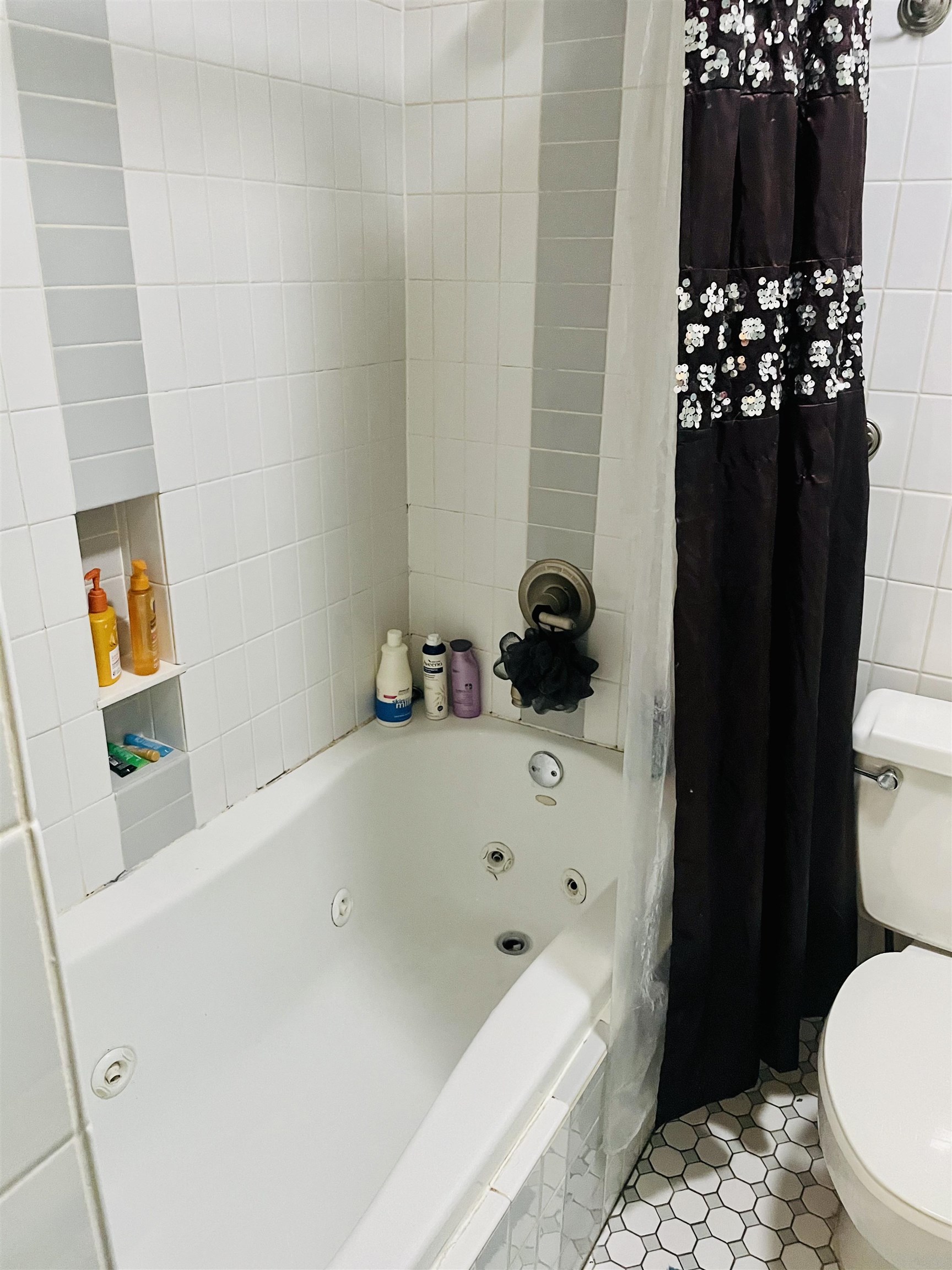 5720 Quince Road, Unit 1 Memphis, TN 38119 - Photo 12 of 18 a bathroom with a bathtub sink and toilet