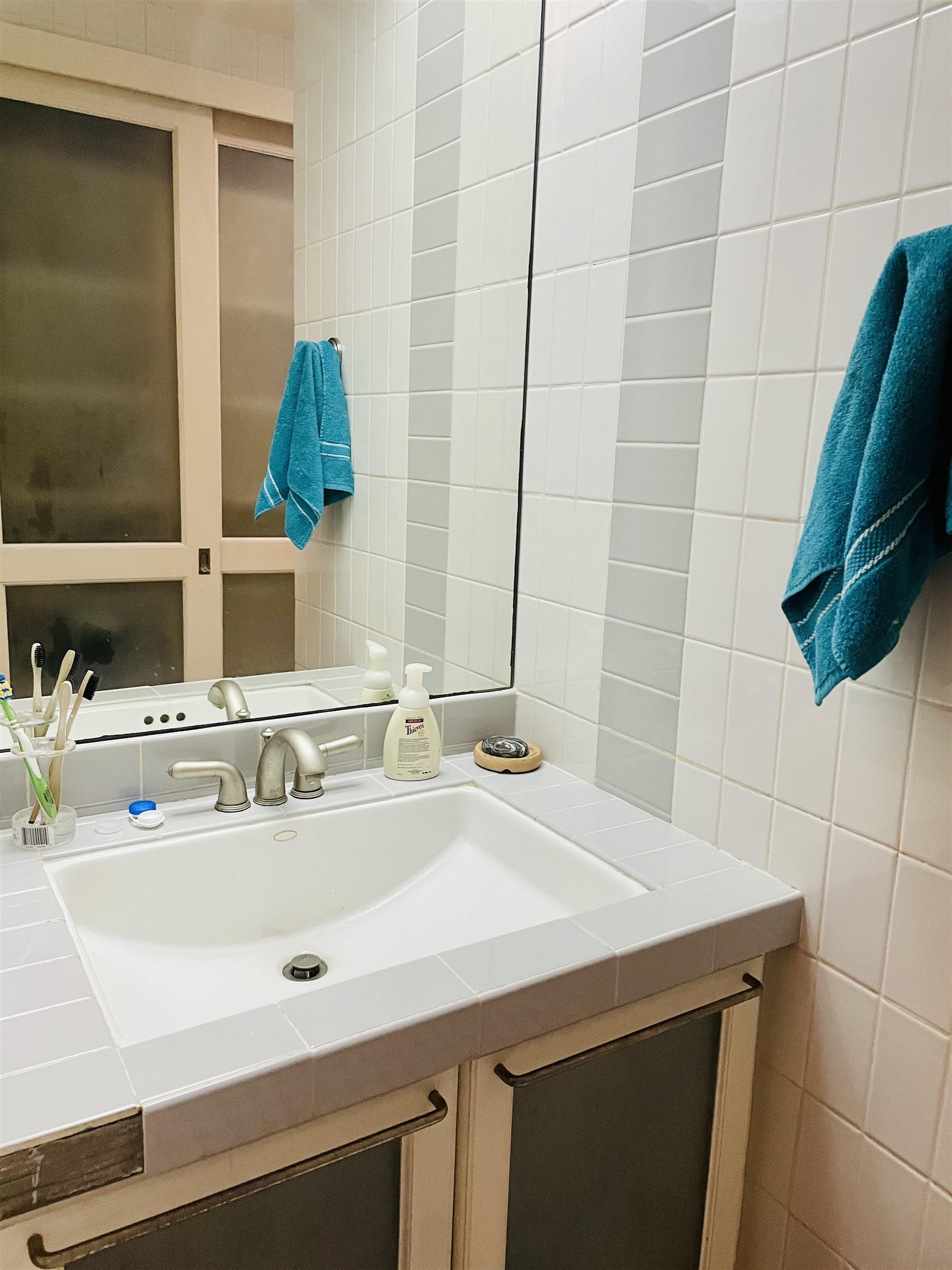 5720 Quince Road, Unit 1 Memphis, TN 38119 - Photo 14 of 18 a bathroom with a sink and a mirror