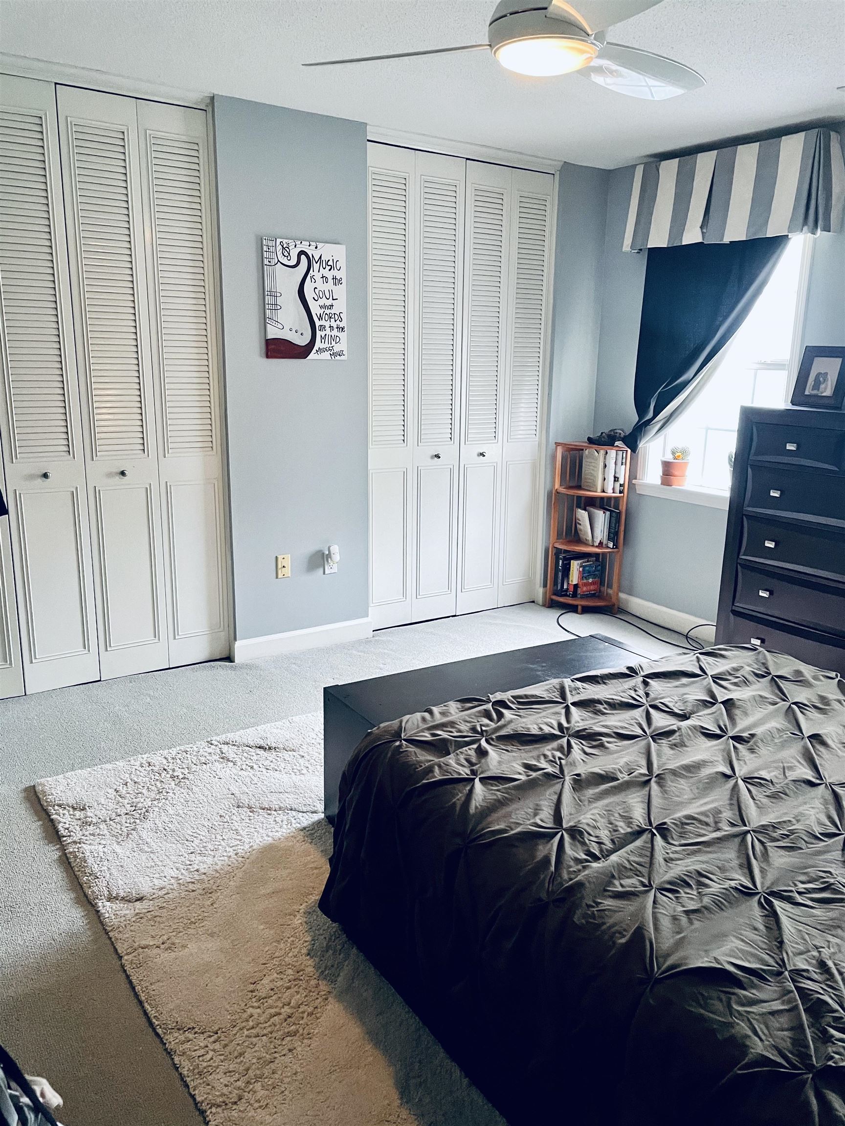 5720 Quince Road, Unit 1 Memphis, TN 38119 - Photo 16 of 18 a bedroom with a bed and a cabinets