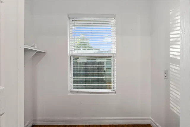 a view of a room that has a window in it