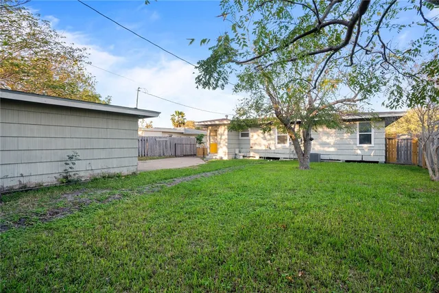 a view of a house with a back yard
