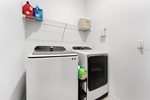 a utility room with dryer and washer