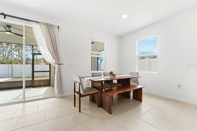 a view of a workspace with furniture and window