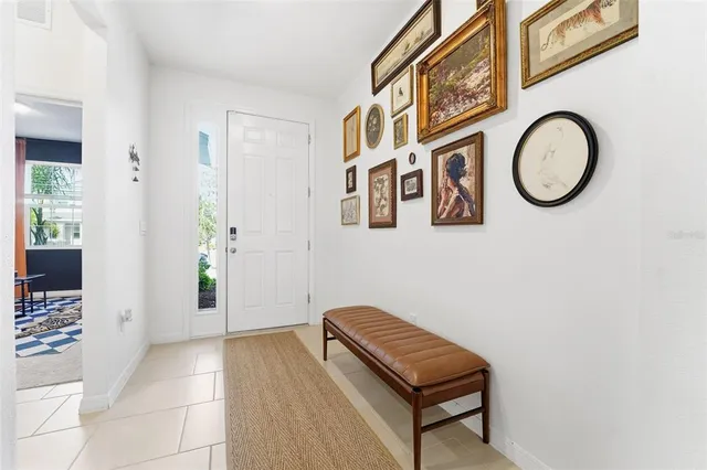 a view of a livingroom with furniture and entryway