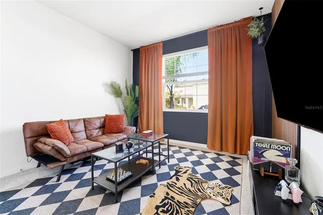 a living room with furniture and a window