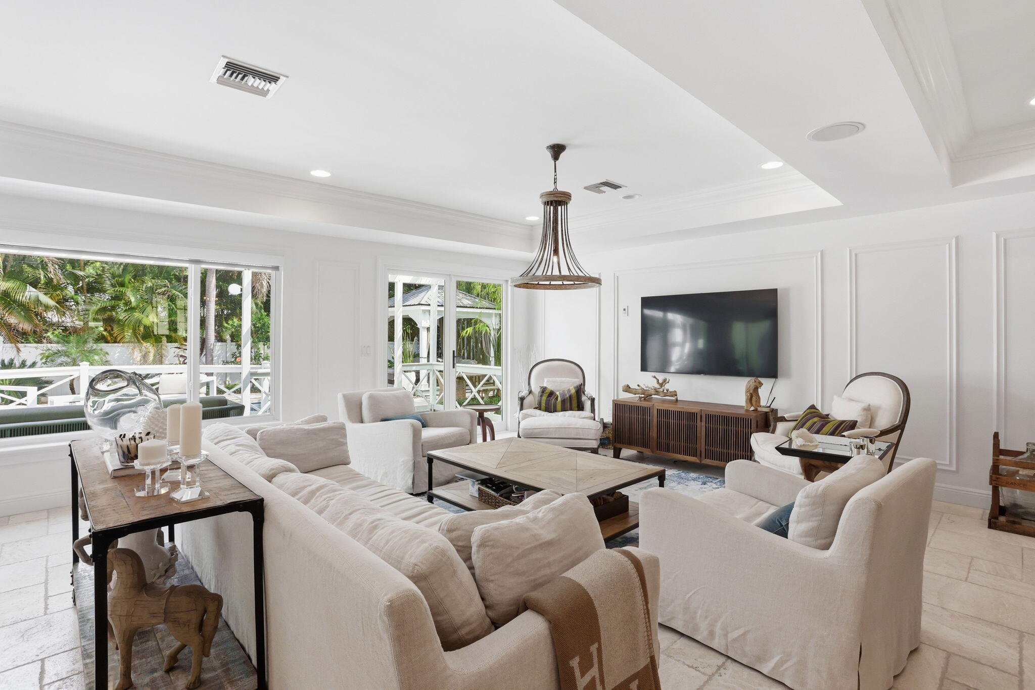 309 Northeast 8th Avenue Delray Beach, FL 33483 - Photo 11 of 43 a living room with furniture a flat screen tv and a large window
