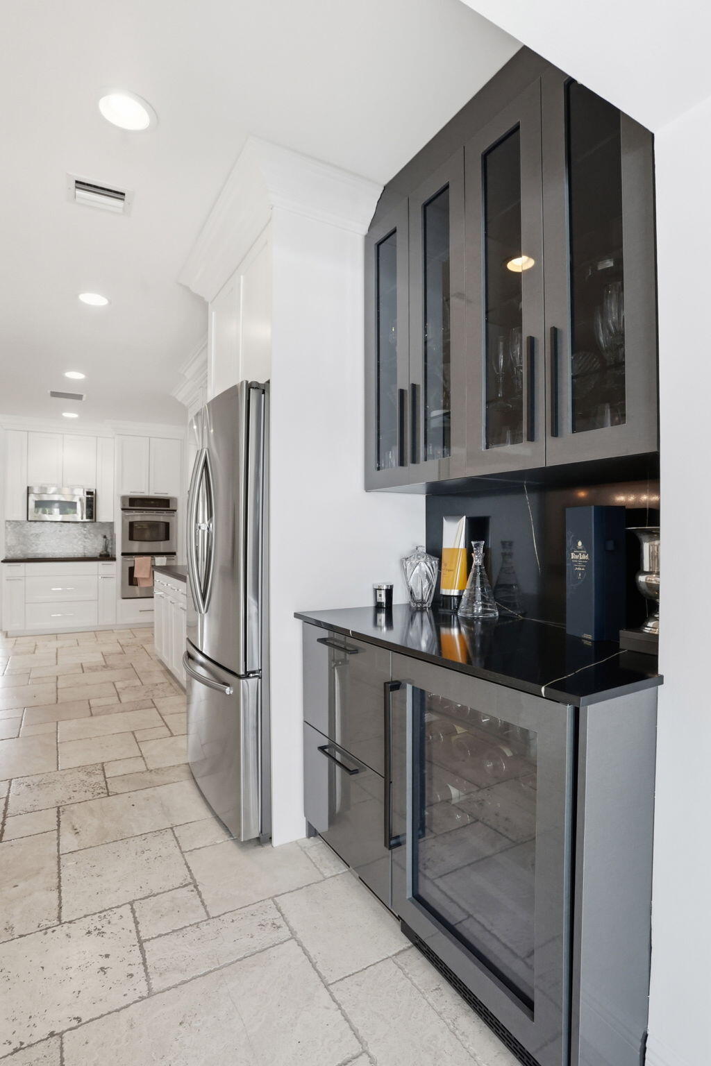 309 Northeast 8th Avenue Delray Beach, FL 33483 - Photo 16 of 43 a kitchen with stainless steel appliances granite countertop a refrigerator and a stove top oven