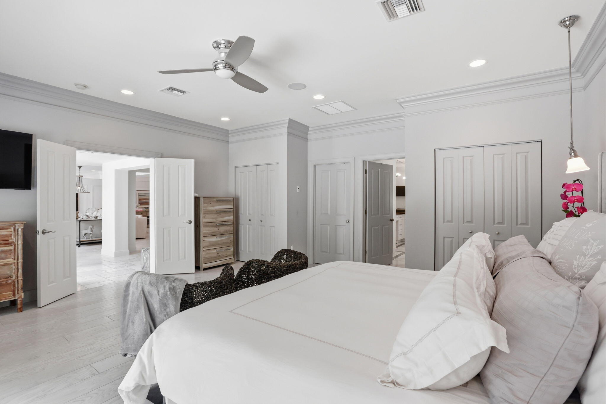 309 Northeast 8th Avenue Delray Beach, FL 33483 - Photo 21 of 43 a bedroom with a bed and a chandelier