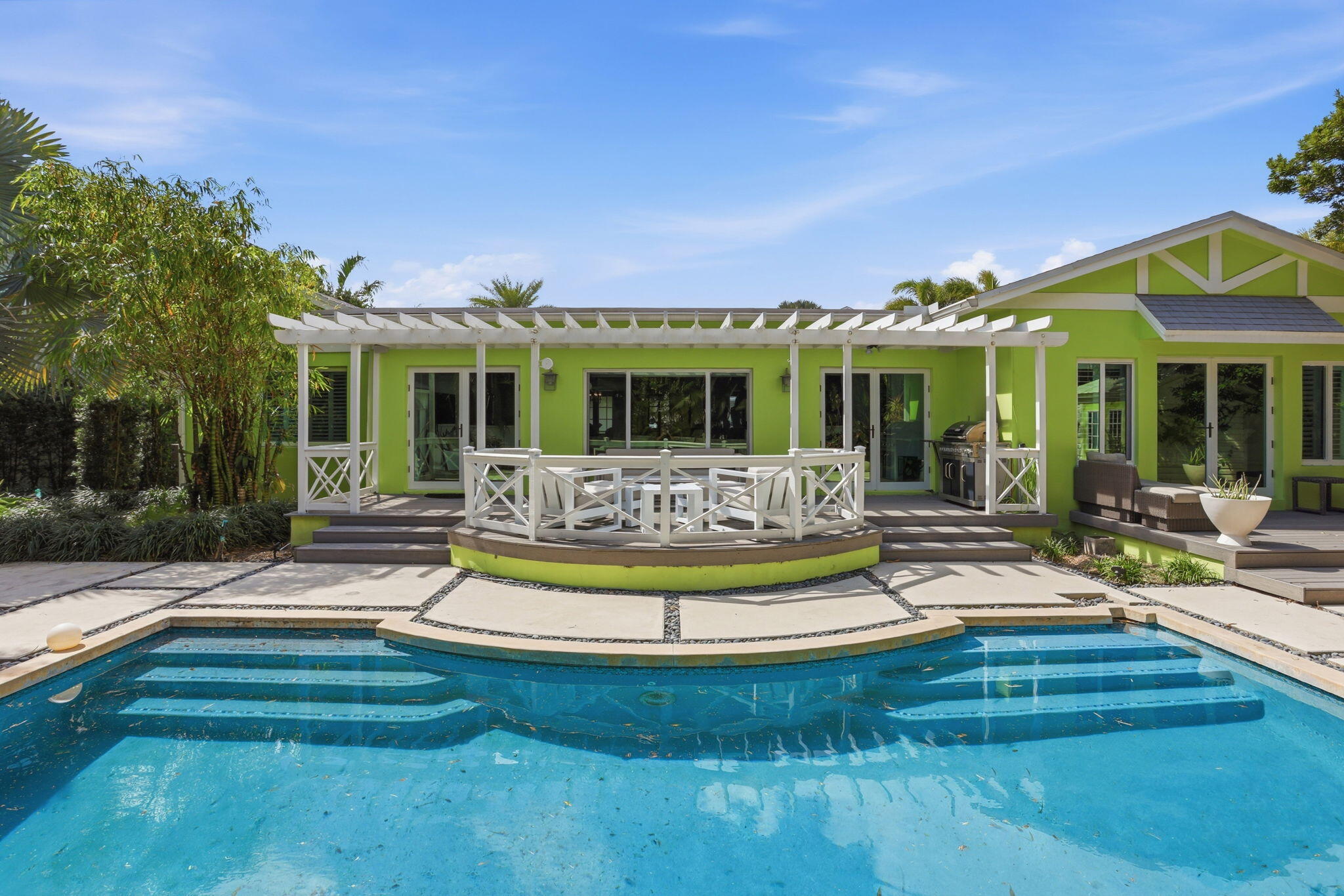 309 Northeast 8th Avenue Delray Beach, FL 33483 - Photo 3 of 43 a view of a house with swimming pool and sitting area