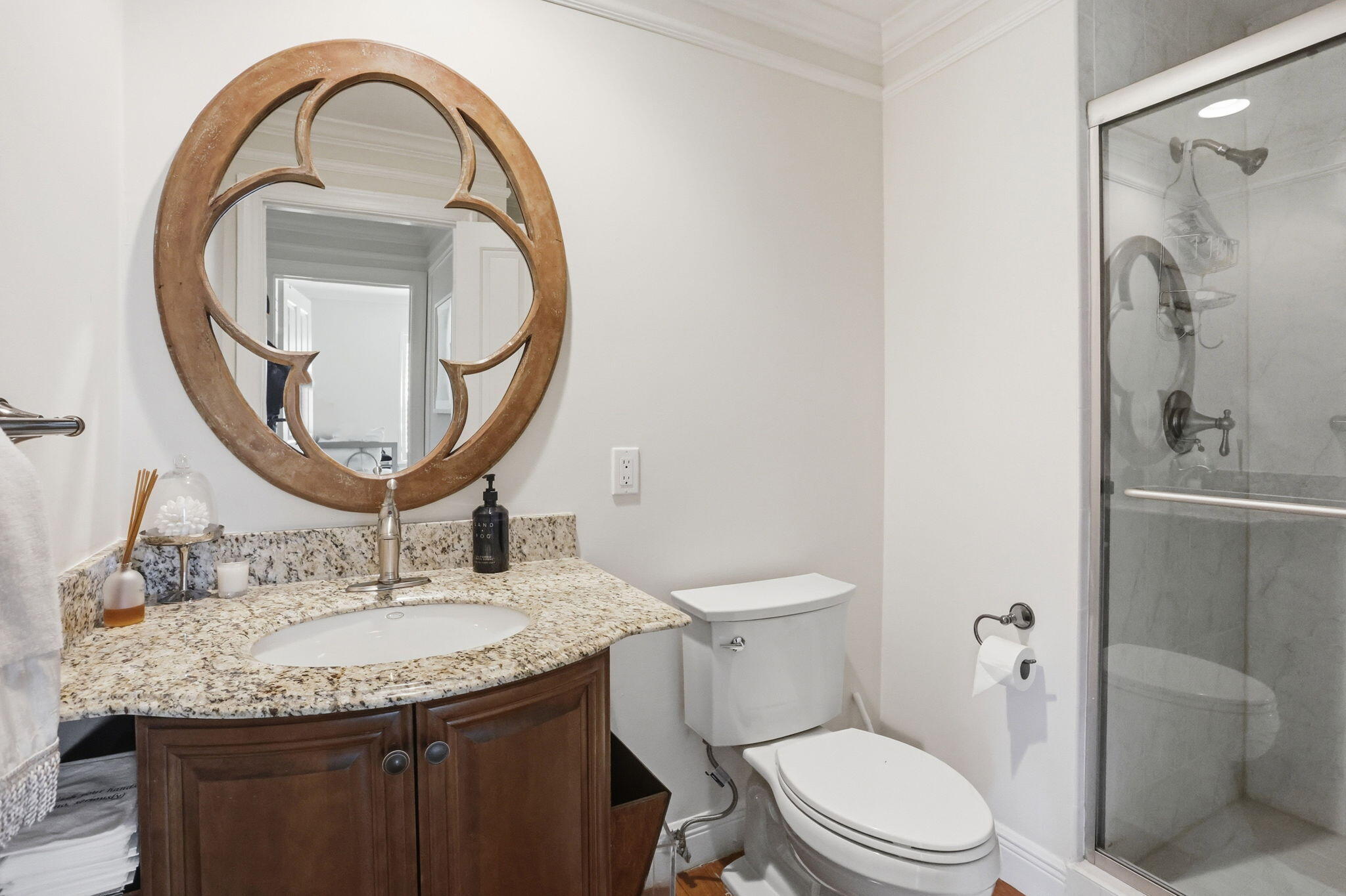 309 Northeast 8th Avenue Delray Beach, FL 33483 - Photo 31 of 43 a bathroom with a granite countertop toilet a sink and a mirror