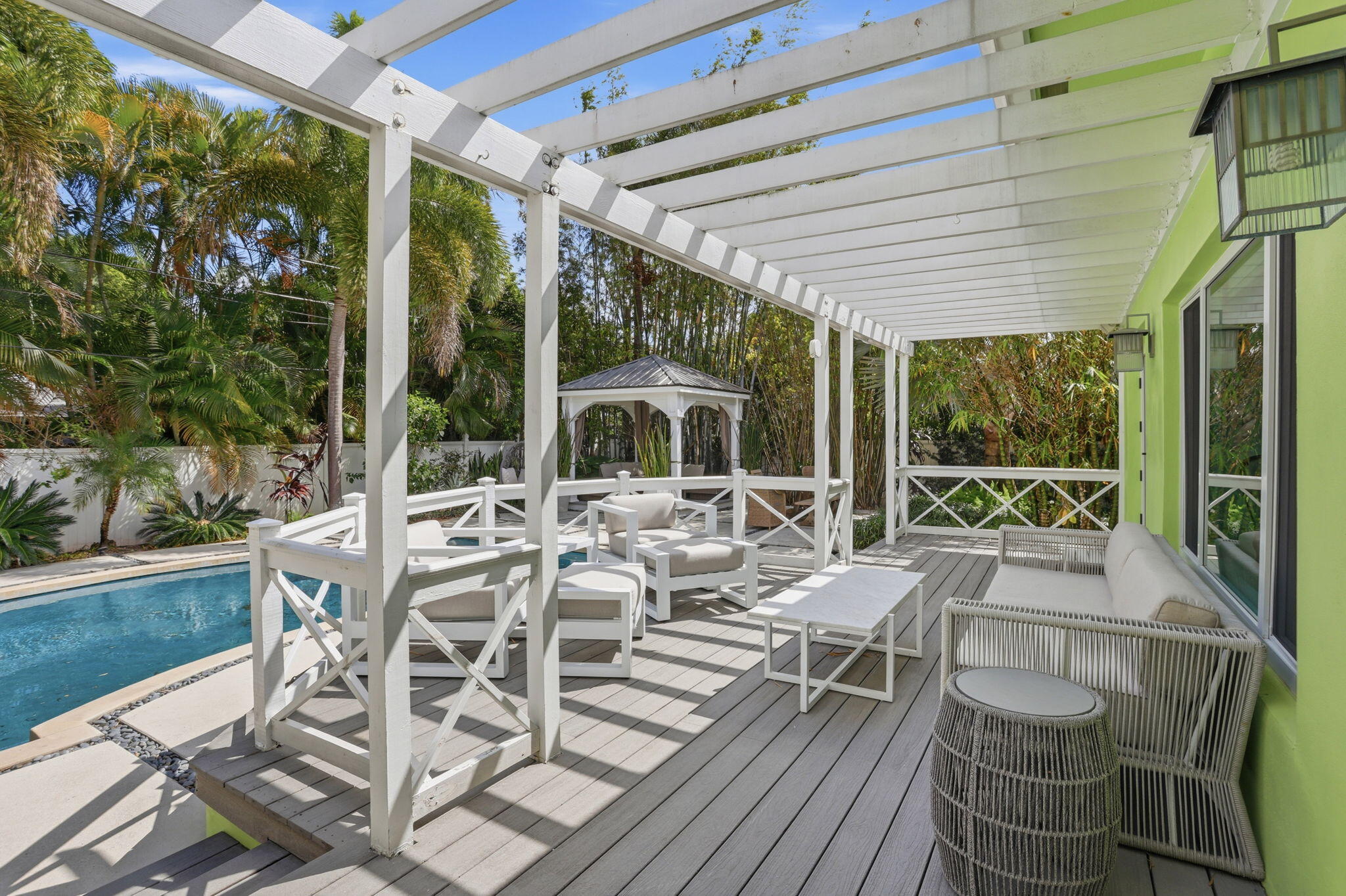 309 Northeast 8th Avenue Delray Beach, FL 33483 - Photo 33 of 43 a view of a patio with table and chairs and wooden floor