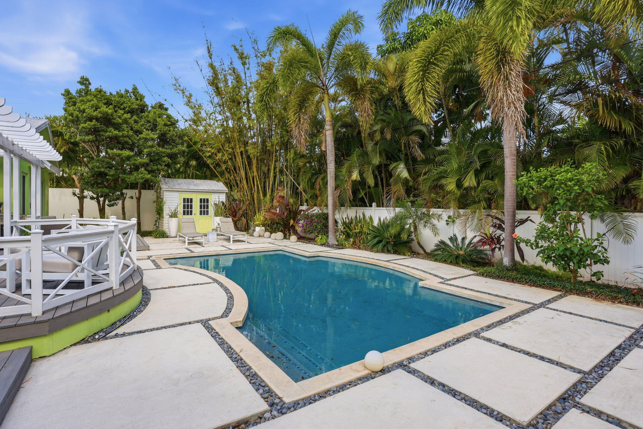 309 Northeast 8th Avenue Delray Beach, FL 33483 - Photo 37 of 43 a view of a swimming pool with a patio